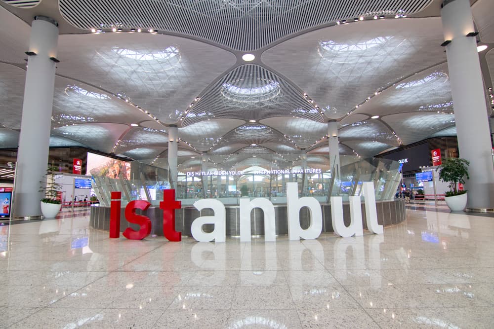 Istanbul Airport terminal interior — spacious modern terminal hall with skylights and passenger walkways