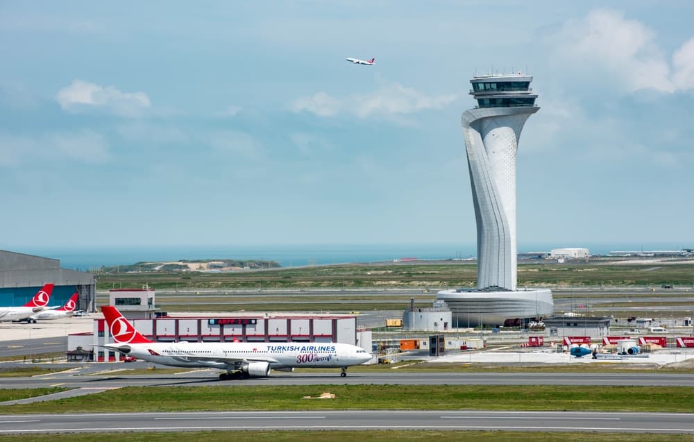 Istanbul Airport control tower and runway — hotels near the airport offer stunning aviation views
